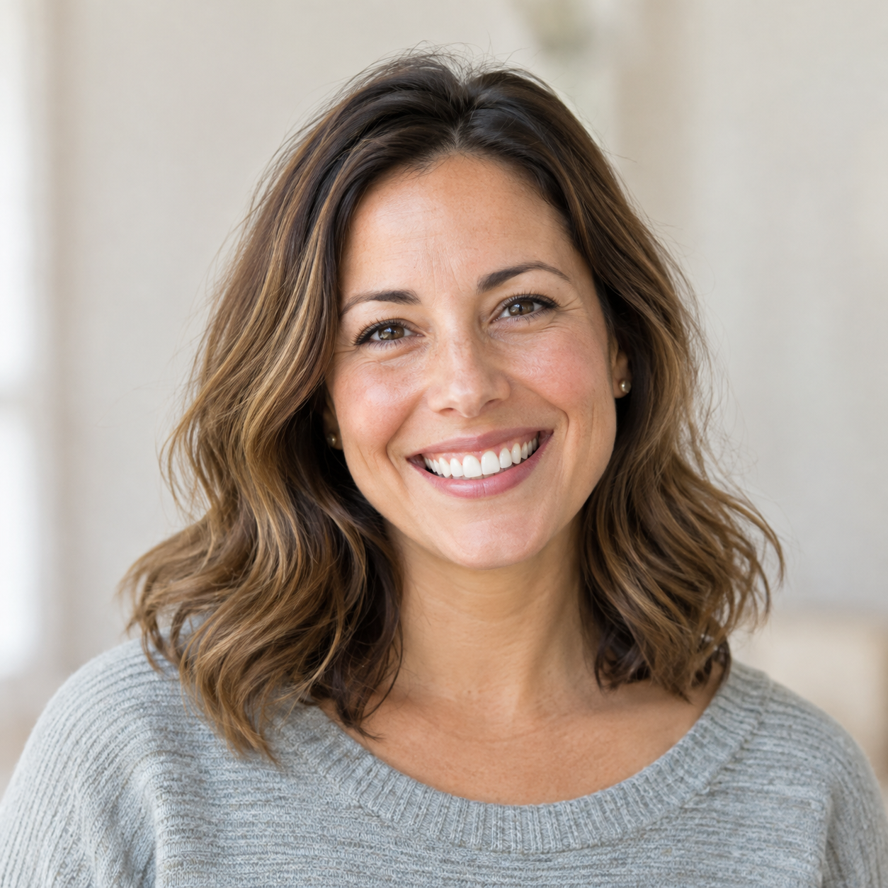 Woman with a warm, natural smile